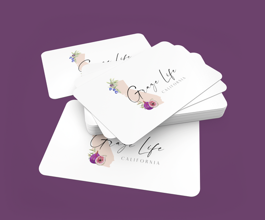 Stack of gift cards with 'Graze Life California' branding on a purple background